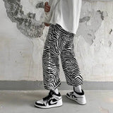 Jinquedai Full print zebra pattern casual pants men's spring and autumn new style Korean loose nine-point pants casual hip hop trousers jinquedai