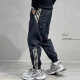 Jinquedai 2024 Summer New Men's Ice Shreds Trousers Contrast Color Spliced Elastic Drawstring Loose Trendy Striped Sweatpants Pants jinquedai