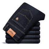 Jinquedai  autumn spring fitted straight stretch denim jeans classic style badge youth men's business casual jeans trousers jinquedai